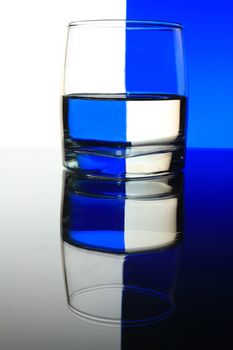 a glass on the white and blue background