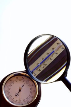 a red barometer on the white background