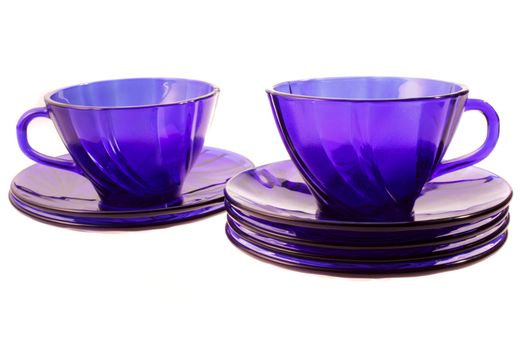 two blue cups with saucers on the white background