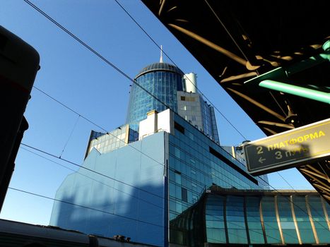 Landscape with modern railway station and blue sky