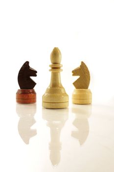 a few chess figures on the white bckground