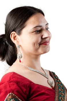 Smiling Indian happy woman wearing  beautifully embroidered red sari