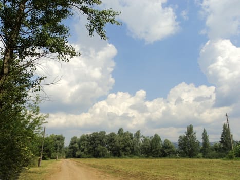 Landscape with road and blue cloudless sky