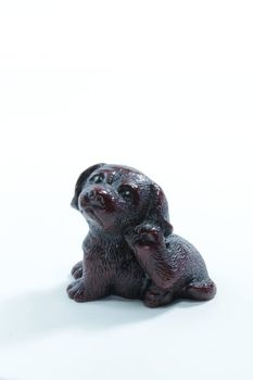 a little toy-dog on the white background