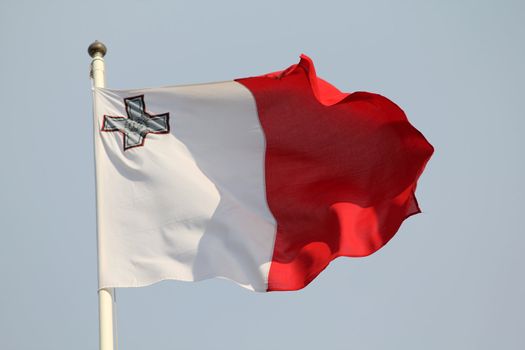 Maltese flag blowing in the wind 