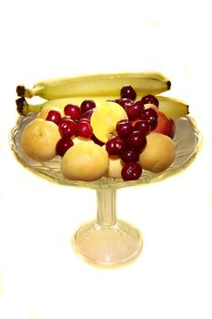 ripe fruits on the cristal plate