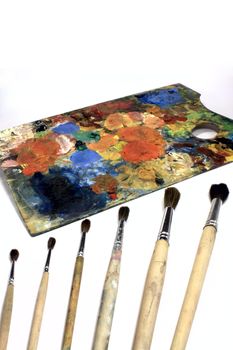 painting brushes and the colored desk