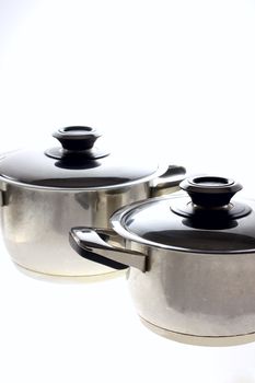 two metal pans on the white background