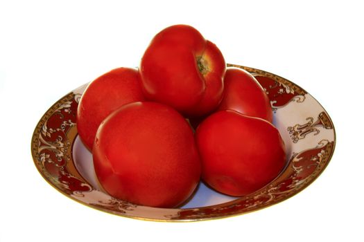 five tomatoes in the plate on the white background