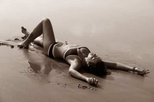 The beautiful girl on a coast of ocean