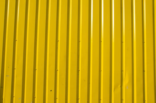 Wall made of wooden yellow planks. Interesting background.