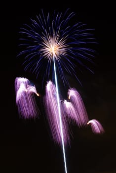 Firework display against black sky