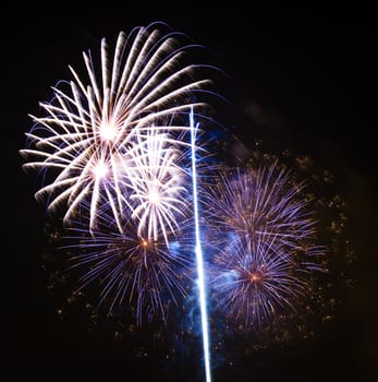 Firework display against black sky