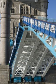 Tower Bridge over the River Thames in London, England. The bascules over which the road normally passes are open to allow ships and boats to pass.