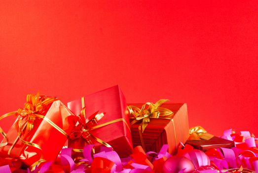 Christmas gifts over red background