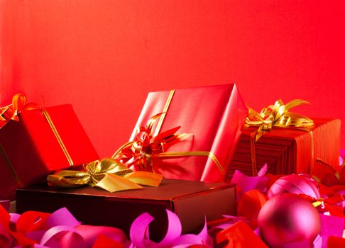 Christmas gifts over red background