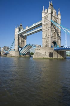 Tower Bridge in open position to allow passage of ships and boats. Historic bridge across the River Thames in London, England