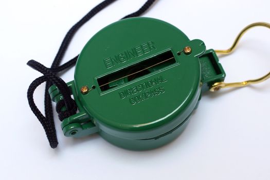 A metal green directional compass 
