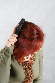young woman combs hair stylist beautiful  individual