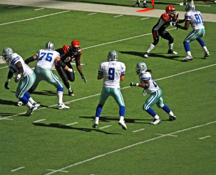 DALLAS - OCT 5: Taken in Texas Stadium in Irving, Texas on Sunday, October 5, 2008. Quarterback Tony Romo is in the pocket preparing to throw a pass down field.
