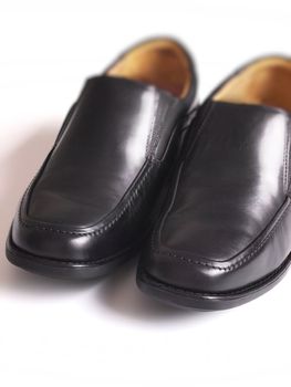 close up of men's black business shoes