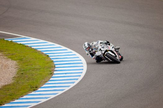 JEREZ DE LA FRONTERA, SPAIN - NOV 20: Stock Extreme motorcyclist Enrique Rocamora takes a curve in the CEV championship on Nov 20, 2010, in Jerez de la Frontera, Spain