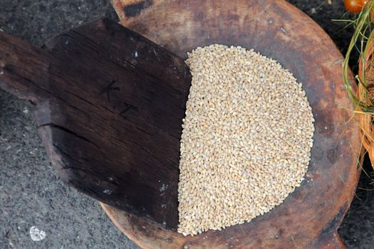 Wooden spoon and wheat