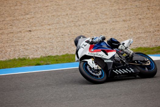 JEREZ DE LA FRONTERA, SPAIN - NOV 20: Stock Extreme motorcyclist Javier Pascual takes a curve in the CEV championship on Nov 20, 2010, in Jerez de la Frontera, Spain