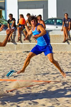 CADIZ, SPAIN - JULY 19: Unidentified players compete in a match between Zonabalonmano.com and CadizSur Seguros BMPY in the 19th league of beach handball of Cadiz on July 19, 2011 in Cadiz, Spain