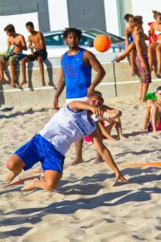 CADIZ, SPAIN - JULY 19: Unidentified players compete in a match between Valcarcel Recuperado and DecoHogar in the 19th league of beach handball of Cadiz on July 19, 2011 in Cadiz, Spain