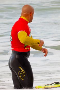 SAN FERNANDO, CADIZ, SPAIN - FEB 19: Unknown bodyboader going to the water on the 2nd championship of Surf and BodyBoard Impoxibol on Feb 19,2011 on the beach of Camposoto of San Fernando, Cadiz, Spain