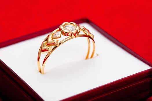 Fantastic gold ring adorned with several white zirconia