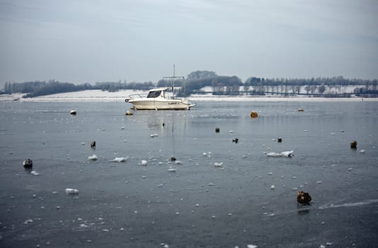 Boat frozen in lake