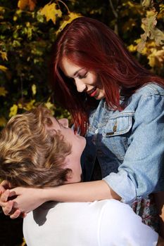Closeup portrait of a romantic young couple looking at each other - Outdoors