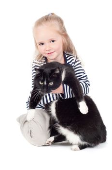 Shot of little cute girl with black cat in studio