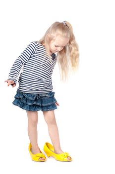 Shot of little cute with mother shoes in studio