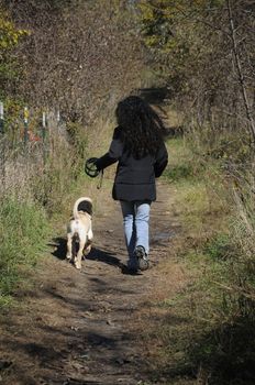 Woman running alongside dog