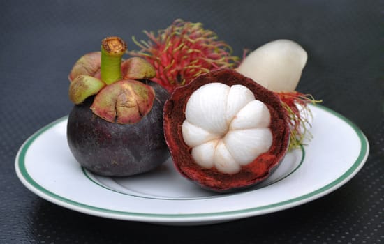 Tropical fruit rambutan and mangosteen on plate