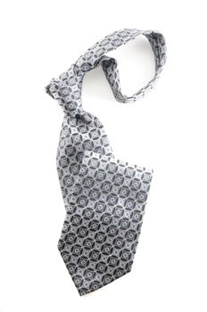 Grey and light blue necktie on white background