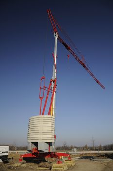 Red crane under blue sky