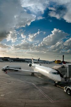 Airplane in tarmac ready to be boarded by flying passengers and crew