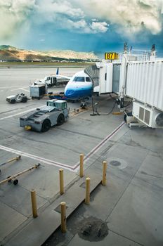 Airplane in tarmac ready to be boarded by flying passengers and crew