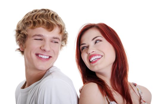 Young caucasian couple looking each other. Isolated on white.