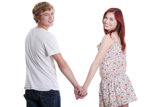 Young caucasian smiling couple holding hands, isolated on white background.