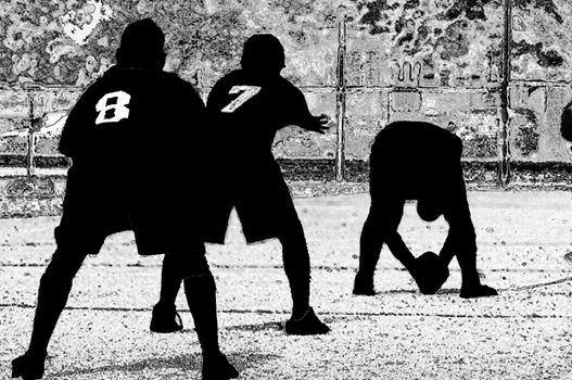 Young men getting ready to run a play in football