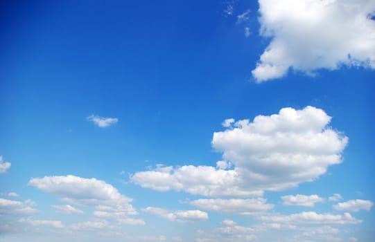 blue sky background with tiny clouds