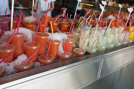 Freshly squeezed orange citrus orange and lemonade for sale in a market