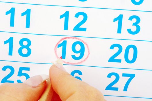 Red circle on a calendar concept for an important day