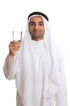 A happy arab man holding up a glass of fresh safe drinking water.