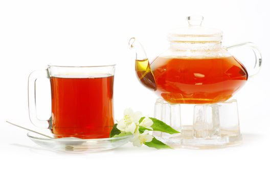 Tea being poured into glass tea cup